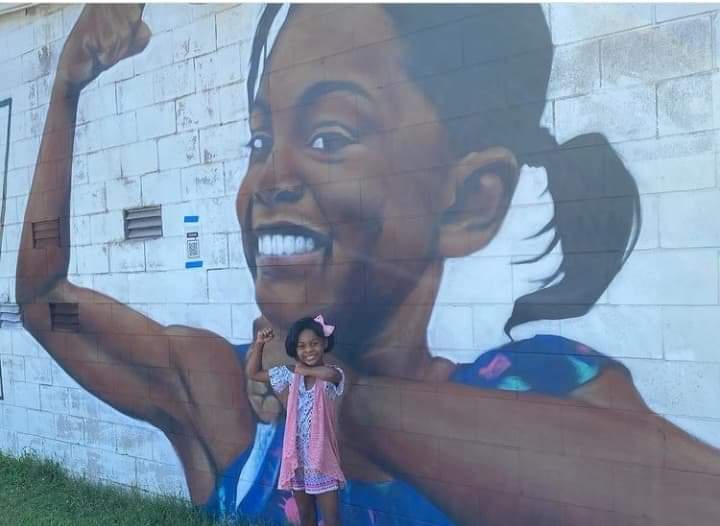 Close view of the child portrait in the Solidarity mural